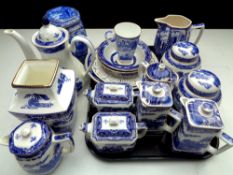 A tray containing a quantity of Ringtons china to include willow pattern teapots, caddies and jugs,