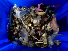 A plastic tub containing a large quantity of assorted lady's and gent's wristwatches (as found)