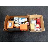 Two boxes containing miscellaneous to include first aid kit, VR headset, clock, Sat Nav,