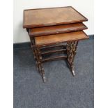 A nest of three mahogany Regency style tables