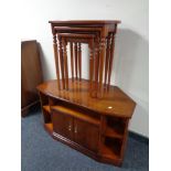 An inlaid yew wood corner entertainment stand together with matching nest of three tables