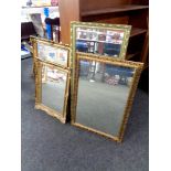 Four gilt framed mirrors