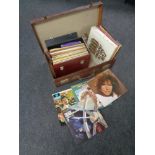 A vintage leather luggage case containing case of LPs to include compilations, musicals,