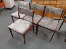 A set of four Danish stained beech dining chairs upholstered in a multi coloured fabric