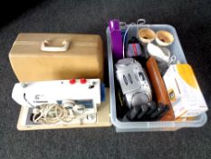 A cased New Home electric sewing machine together with a box containing CD radio,