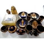 A box containing assorted Egyptian and Grecian wall plates, figurines,