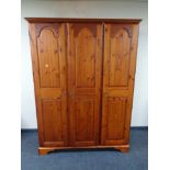 A Ducal pine triple door wardrobe