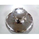 A silver inkwell,