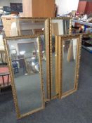 Four gilt framed hall mirrors