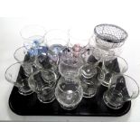 A tray containing assorted drinking glasses, glass dessert bowls,