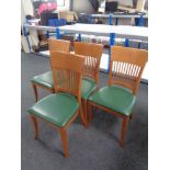 A set of four contemporary rail back chairs