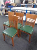 A set of four contemporary rail back chairs