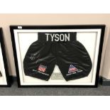 A sporting memorabilia montage : A signed pair of boxing shorts, Mike Tyson 'Kid Dynamite',