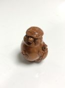A carved Chinese hardwood netsuke - Turtles on a pot
