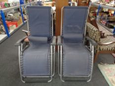 A pair of Latuma adjustable garden lounger armchairs