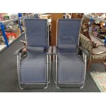 A pair of Latuma adjustable garden lounger armchairs