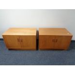 A pair of 20th century teak double door low cupboards