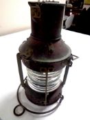 A copper ship's lamp