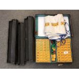 A cased Mahjong set with instructions and stands