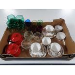 A box containing two ceramic Le Creuset lidded pots, assorted glassware,
