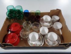 A box containing two ceramic Le Creuset lidded pots, assorted glassware,