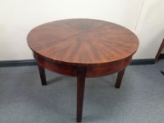 An antique mahogany circular table