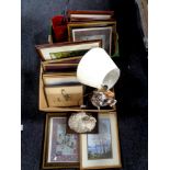 Two boxes containing pictures, figural table lamp with shade,
