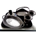 A tray containing six pieces of Arts and Crafts pewter