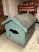 A large wooden painted dog kennel with felt roof