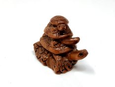 A carved Chinese hardwood netsuke - Turtle family