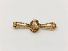 A 15ct gold rope twist brooch set with citrine CONDITION REPORT: 4.