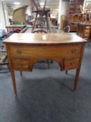 An Edwardian mahogany bow fronted three drawer chest