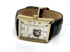 A Gentleman's Earnshaw gold plated wrist watch on black leather strap