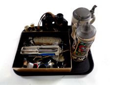 A tray containing a pair of Sirius 7 x 50 binoculars, two miniature brass miner's lamps,