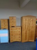 A contemporary pine double door wardrobe together with matching five drawer chest and pair of three