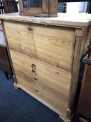 A 19th century continental pine four drawer secretaire chest