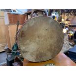 An early 20th century Native American hand made drum in its original condition with original paint