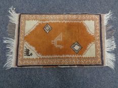 A small Persian hearth rug