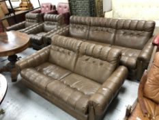 A twentieth century Continental four piece brown leather lounge suite comprising of three seater