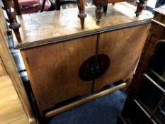 A 20th century double door serving cabinet,