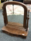 A mahogany dressing table mirror