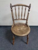 A beech spindle backed chair together with an embroidered foot stool