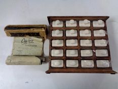 A vintage Otis King calculator in box with instructions together with a small oak cabinet