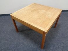 A continental teak square coffee table
