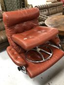 A twentieth century Continental red buttoned leather swivel armchair on chrome base together with