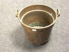 A 19th century copper and brass twin handled bucket