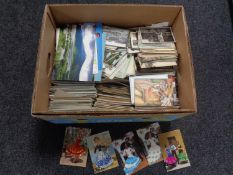 A box containing a large quantity of old and modern postcards including Spanish silks