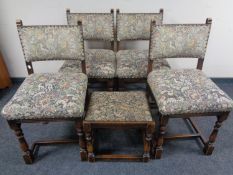 A set of four beech dining chairs in studded tapestry fabric together with similar footstool