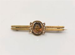 An antique gold citrine and pearl bar brooch CONDITION REPORT: Apparently unmarked.
