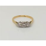 An 18ct gold three stone diamond ring, size P CONDITION REPORT: 2.